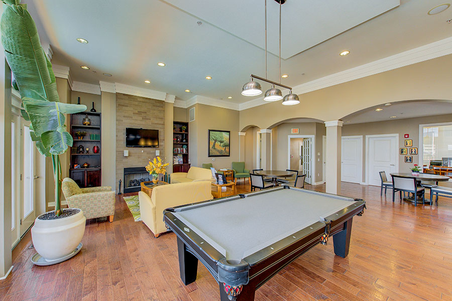 If your Indianapolis apartment has a clubhouse like this one at Waverley Apartments, ask about renting it for your parties. A high-ceilinged rec room with pool table at Waverley Apartments.