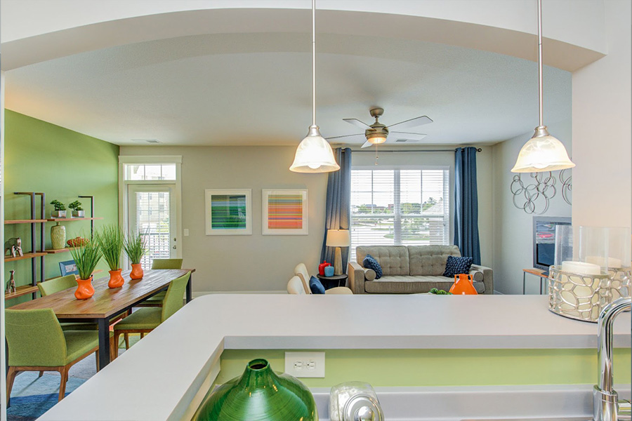 Looking into the bright living area from kitchen.