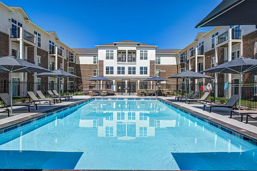 Not sure what a community means by amenities? This pool at Block 20 Apartments is one example of an amenity. Pristine pool surrounded by apartment buildings at Block 20 Apartments.