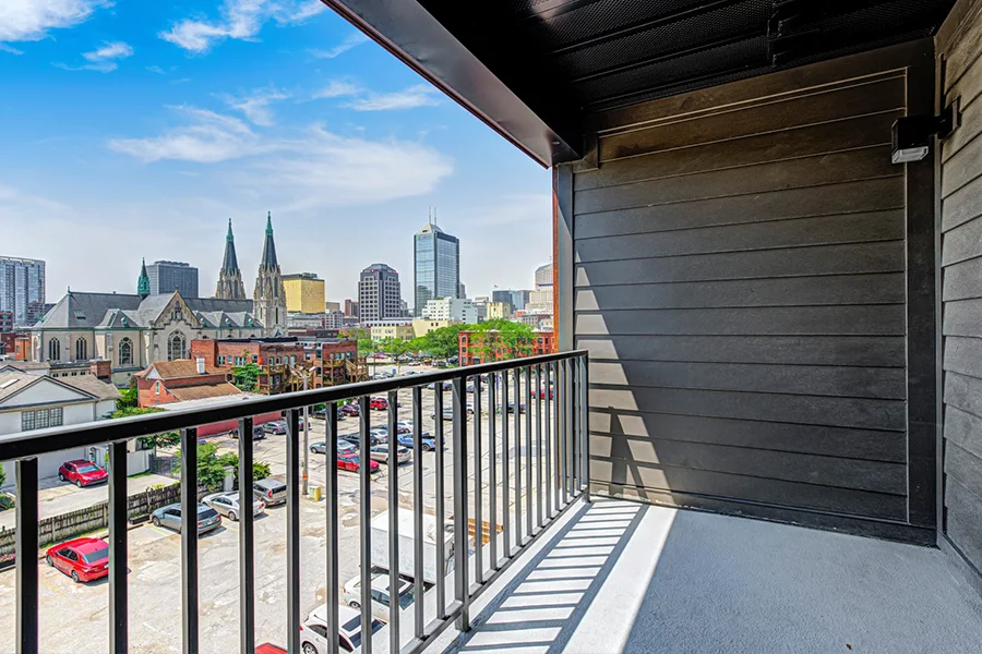 Balcony view of the cityscape on a sunny day from Block 20 apartments
